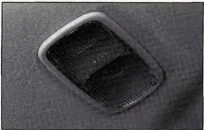 Close-up of a dark rectangular object with a textured surface, possibly a mesh or material sample (no visible text or symbols)