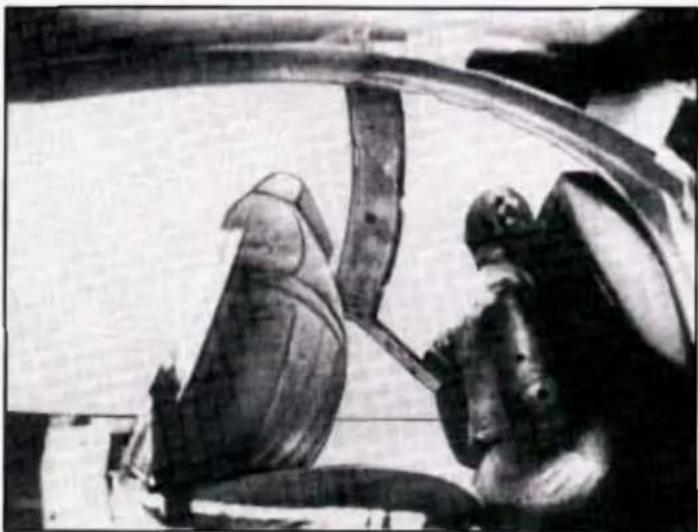 Black-and-white historical illustration of two figures in ancient attire, one seated and one standing, with no visible text or symbols.