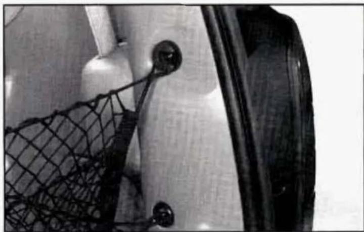 Close-up of a mechanical component with a mesh net and circular component (no visible text or symbols)