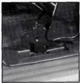Close-up of a mechanical component with visible parts and mounting brackets (no text or symbols)