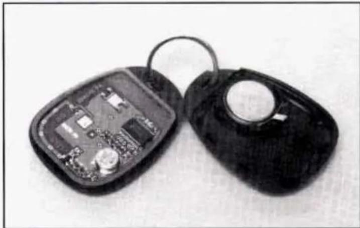 Two black keys with exposed internal circuit boards, one open and one closed (no text or symbols visible)