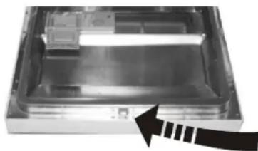 Interior view of a rectangular electronic device with internal components and a black arrow pointing to a section (no visible text or symbols)