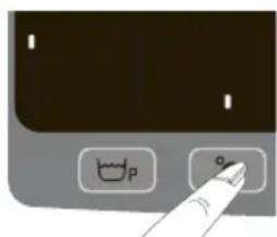 Close-up of a computer control panel with icons and a finger pointing to the button