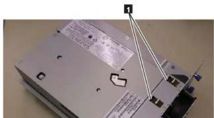 Close-up of a device with visible labels and annotations, including a label with '1' and a warning symbol.