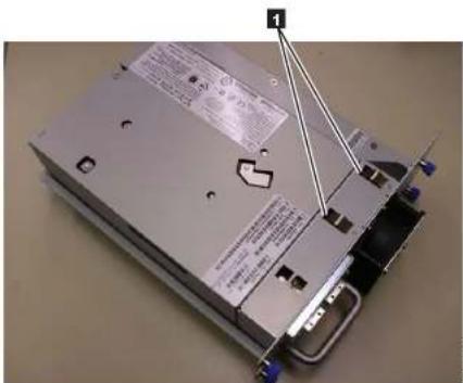 Photo of a computer drive with visible label and warning text on the cover