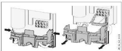 Technical diagram showing vehicle assembly or maintenance process with labeled components and directional arrows indicating movement
