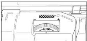 Technical diagram showing a mechanical or fluid system with labeled components and directional arrows, including 'AUTO' and checkered pattern.