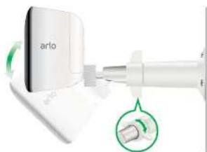 Close-up of a white electronic device labeled 'arlo' with a green circular inset showing a small component (no readable text or symbols)