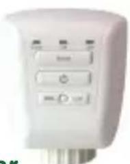Close-up of a white electronic device with control buttons (no visible text or symbols)