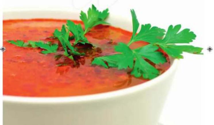 Close-up of a bowl of red sauce garnished with fresh cilantro leaves (no text or symbols visible)