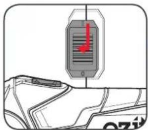 Diagram showing a vehicle's front view with a red downward arrow indicating a traffic sign or sensor, and partial text 'OZI' visible.