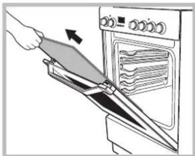 Illustration of a hand using a spatula to clean or operate an oven (no text or symbols visible)