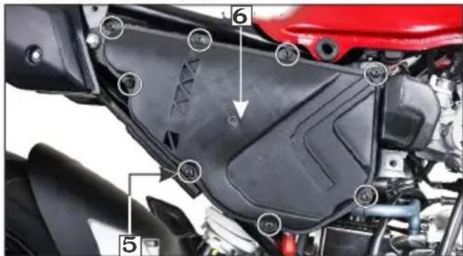 Labeled mechanical component diagram showing parts numbered 5 and 6 with annotations for assembly or repair.