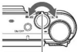 Diagram showing mechanical assembly with labeled parts and directional arrows indicating motion or movement