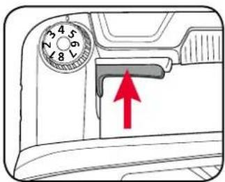 Diagram showing a device's front panel with a dial and red arrow indicating a component or operation.