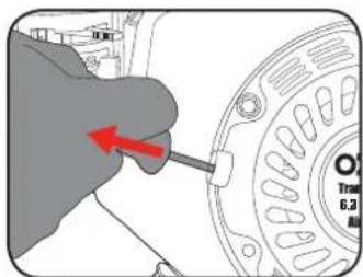Diagram showing a hand holding a screwdriver next to a car wheel, with red arrow indicating clockwise direction.