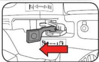Diagram showing a car interior with directional arrows and control buttons, highlighting a red arrow pointing left.