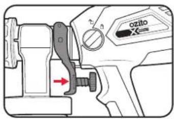 Technical diagram of a mechanical device with labeled components and directional arrow indicating movement or force