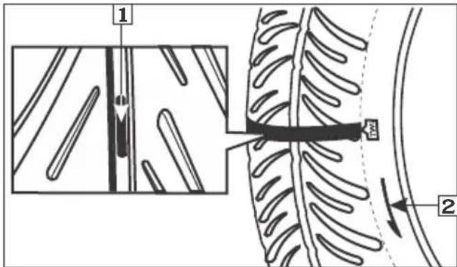 Technical diagram showing mechanical assembly with labeled parts and directional arrows