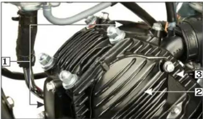 Close-up mechanical component with numbered annotations pointing to parts of the engine and fan assembly.