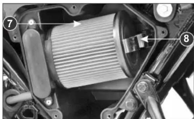 Technical diagram of a motorcycle's internal gear assembly with numbered components and directional arrows indicating motion or flow.
