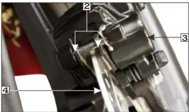 Technical diagram of a mechanical assembly with numbered components and directional arrows indicating motion or flow.