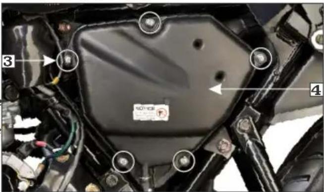 Close-up of a car engine component with numbered annotations and a visible warning label