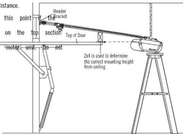 istance. this point on the top motor unit. Do not Header Bracket Section Top of Door 2x4 is used to determine the correct mounting height from ceiling.