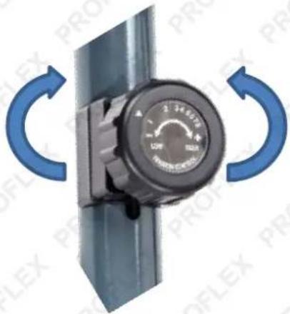 Close-up of a black industrial control knob with blue circular arrows indicating clockwise rotation (no text or symbols)