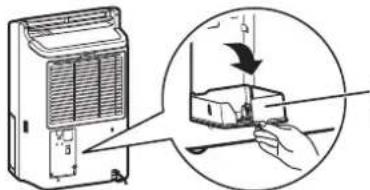 Diagram showing a hand operating a device with a magnified view of the component being cut off or removed, including a downward arrow indicating motion.