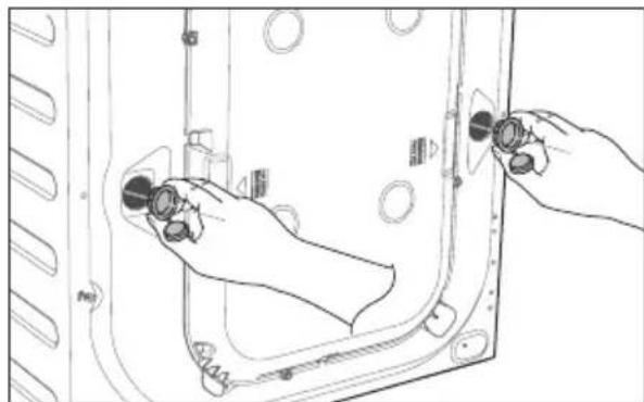 Line drawing of hands adjusting a door panel with buttons and mounting holes.