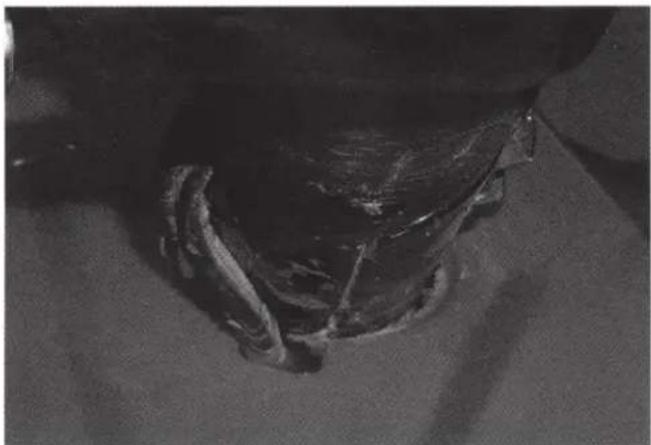 Close-up of a mechanical component with visible internal structure and textured surface (no text or symbols)