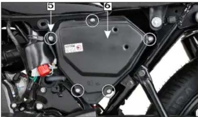 Technical diagram of a motorcycle engine compartment with numbered parts and highlighted features