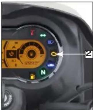 Close-up of a motor control dial with Chinese and English labels, showing directional indicators and a numbered label '2'