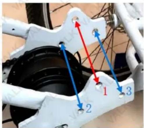 Technical diagram of a bicycle suspension system with labeled components and directional arrows indicating motion paths.