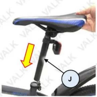 Instructional image showing a hand holding a bicycle seat with a yellow arrow and label 'J' pointing to the seat.