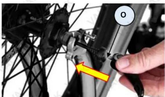 Close-up of a bicycle's wheel assembly with a hand adjusting the component (no visible text or symbols)