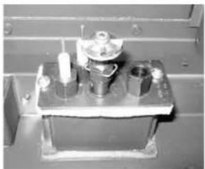 Mechanical component with cylindrical and mounting features (no visible text or symbols)