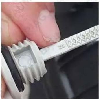 Baumr-AG 720SX - Step 3: Inspect the Oil Dipstick and wipe it with a clean cloth. - 1