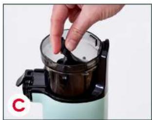 Close-up of a hand placing a glass lid onto a small kitchen appliance (no text or symbols visible)