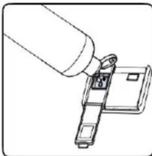 Line drawing of a hand inserting a small electronic component into a device (no text or symbols)
