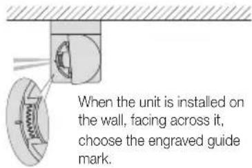 When the unit is installed on the wall, facing across it, choose the engraved guide guide mark.