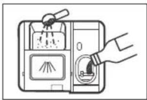 Diagram showing a hand inserting a plug into a device with labeled components and a valve, likely illustrating a mechanical or electrical process.