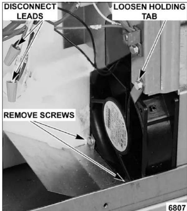 DISCONNECT LEADS LOOSEN HOLDING TAB REMOVE SCREWS 6807