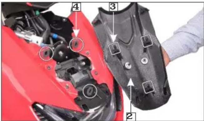 Labeled diagram of a red motorcycle engine compartment showing parts numbered 2, 3, and 4 with annotations for mechanical components.