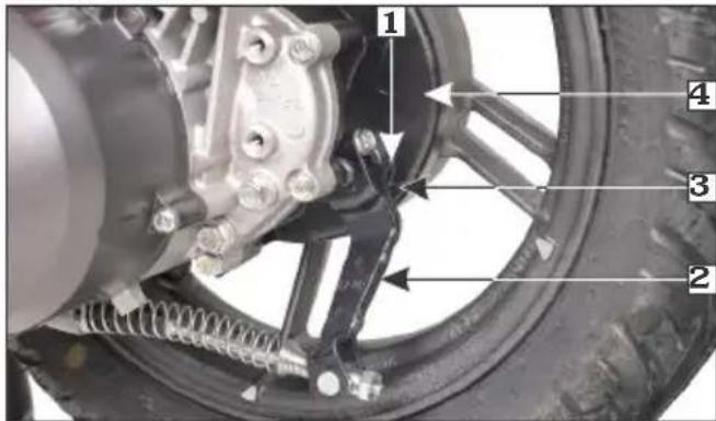 Labeled mechanical assembly diagram showing components like wheel, brake, and spring assembly with numbered parts