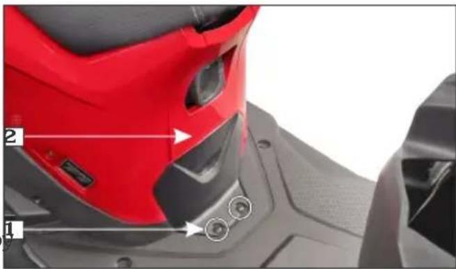 Close-up of a red sports helmet with numbered annotations pointing to specific parts, including buttons and buttons labeled 1 and 2.