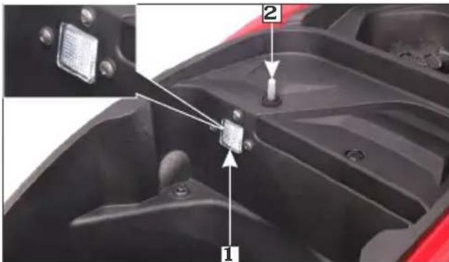 Technical diagram of a mechanical component with labeled parts 1 and 2, showing internal structure and alignment indicators.