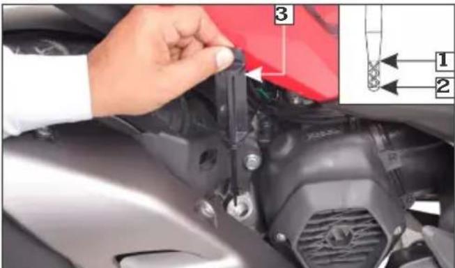 Close-up of a car engine component with labeled parts and an inset diagram showing parts numbered 1 and 2.