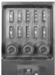 Close-up of a control panel with multiple labeled buttons and dials, likely an ATM or industrial machine interface.